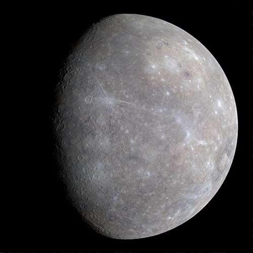 The planet Mercury, sunlit, against black space.